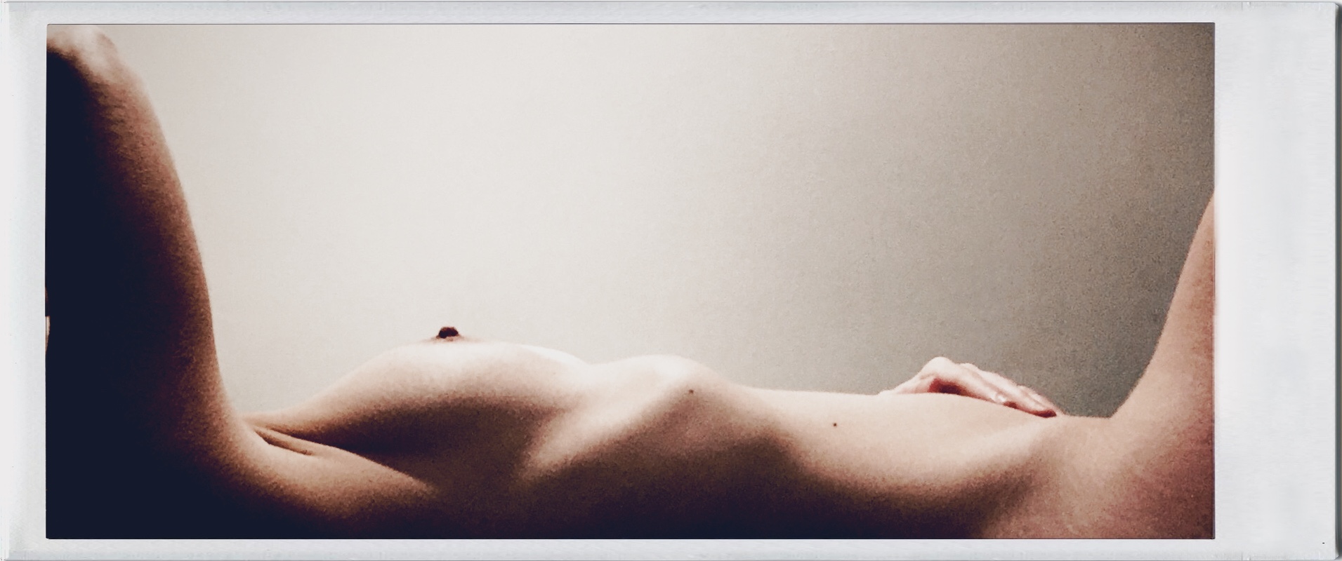 Altered behaviour - an image of me lying naked on a bed, seen from the side