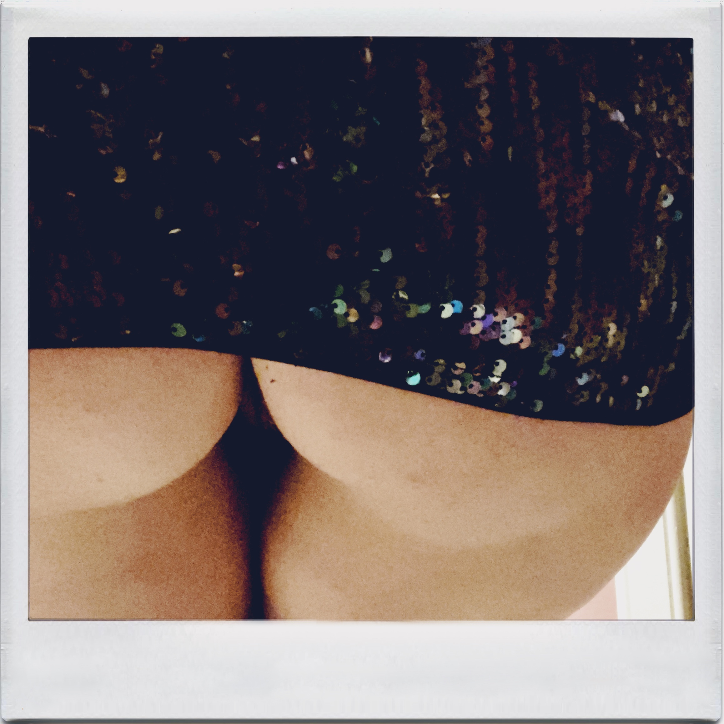 An image of my arse, revealed as I have pulled up my dress covered in sequins